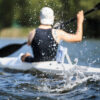 Athlete rowing kayak